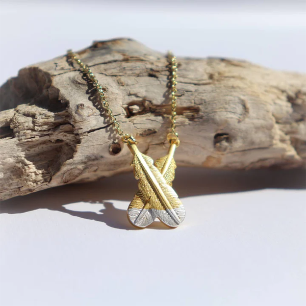 Little Taonga Necklace Crossed Huia Feathers Silver Tips on Gold
