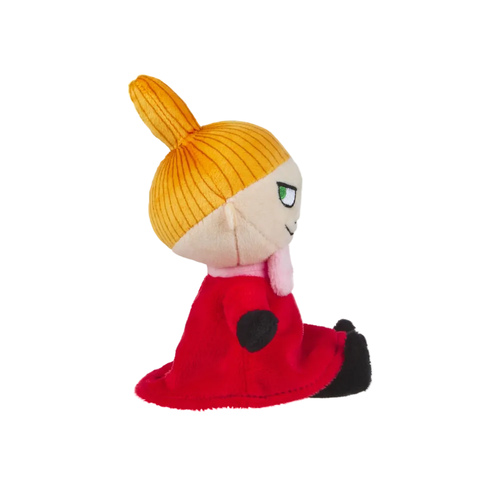 Plush toy with a yellow beanie, red outfit, and black shoes on a white background
