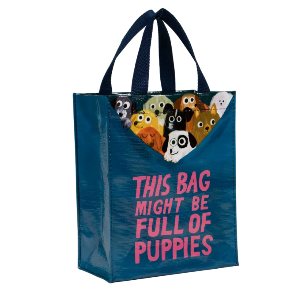 Blue tote bag with cartoon dog faces and 'This bag might be full of puppies' text on a white background