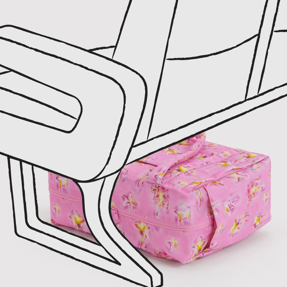 Pink floral-patterned bag on a white background