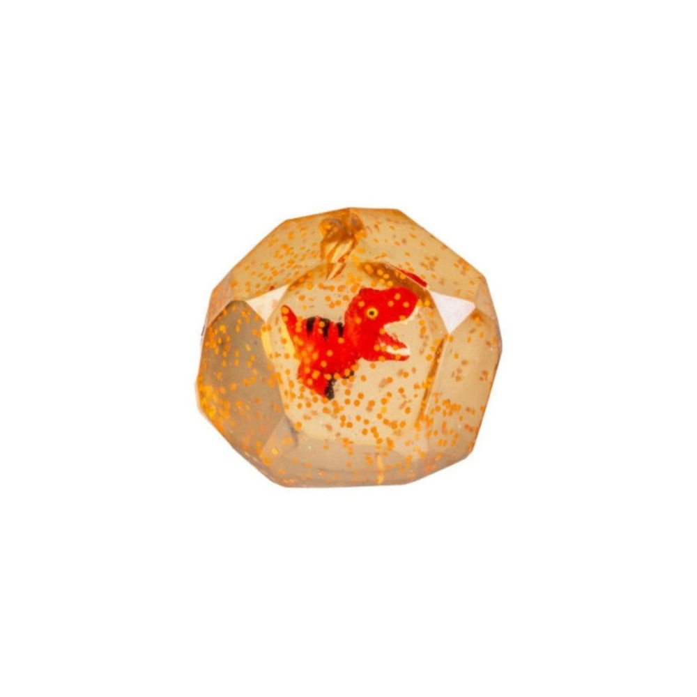 A faceted clear resin pendant featuring a small red dinosaur toy suspended inside, with tiny gold glitter throughout, shown on a plain white background.