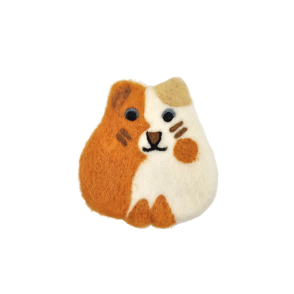 A felt cat shaped coaster a cute tri-color cat, featuring orange, white, and beige colors with embroidered facial details, set against a plain white background.