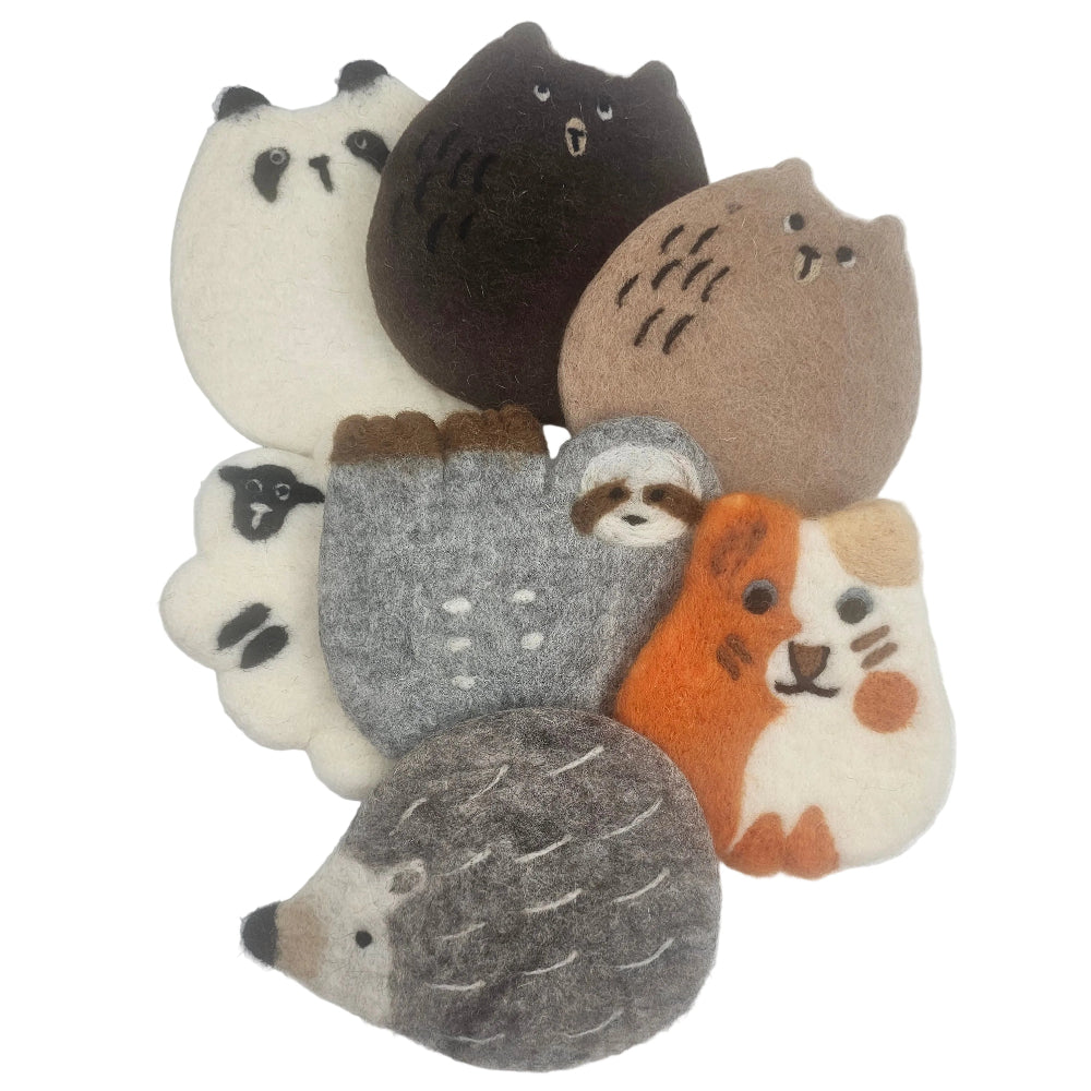 A set of seven felt animal coasters in various colors and species, including a cat, owl, bear, mouse, sloth, hedgehog, and rabbit, arranged on a plain white surface.