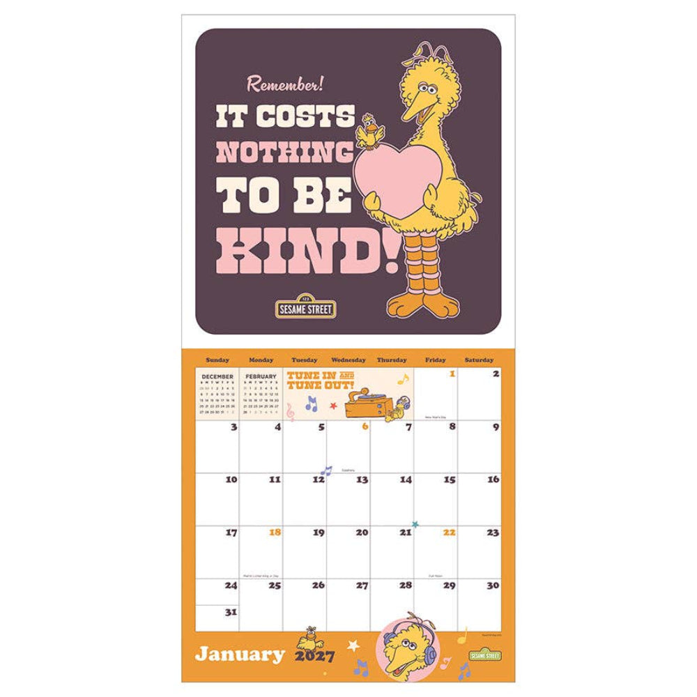 Sesame Street 2027 wall calendar featuring a Sesame Street Mottley card at the top with the quote 'Remember! IT COSTS NOTHING TO BE KIND!' and a calendar grid below on an orange background.