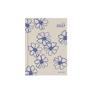 A 2027 daily planner with a beige cover decorated with blue floral line drawings, shown on a light gray background.