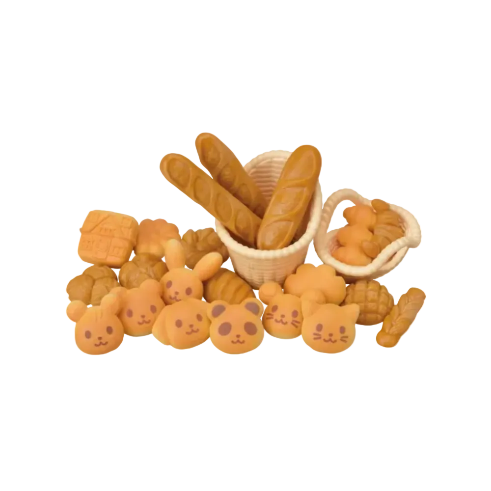 A set of cute, bakery-themed squishy toys shaped like bread, including baguettes, croissants, and bunny/cat faces, arranged on a white background.