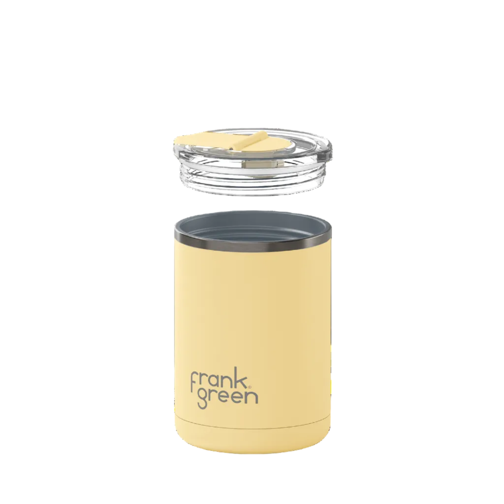 A pale yellow Frank Green travel tumbler with a clear lid and yellow flip-straw insert, shown against a solid white background.
