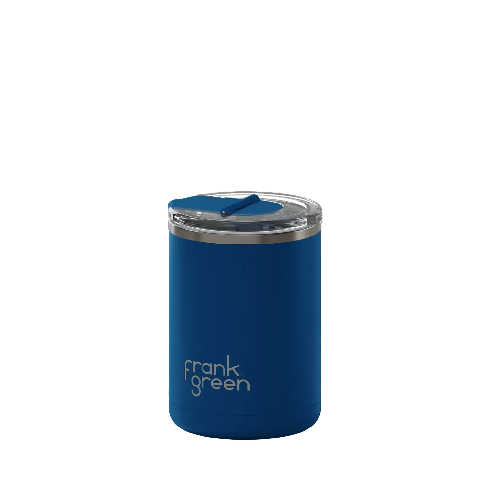 A blue Frank Green vacuum-insulated tumbler with a clear lid and blue straw, shown on a plain white background.