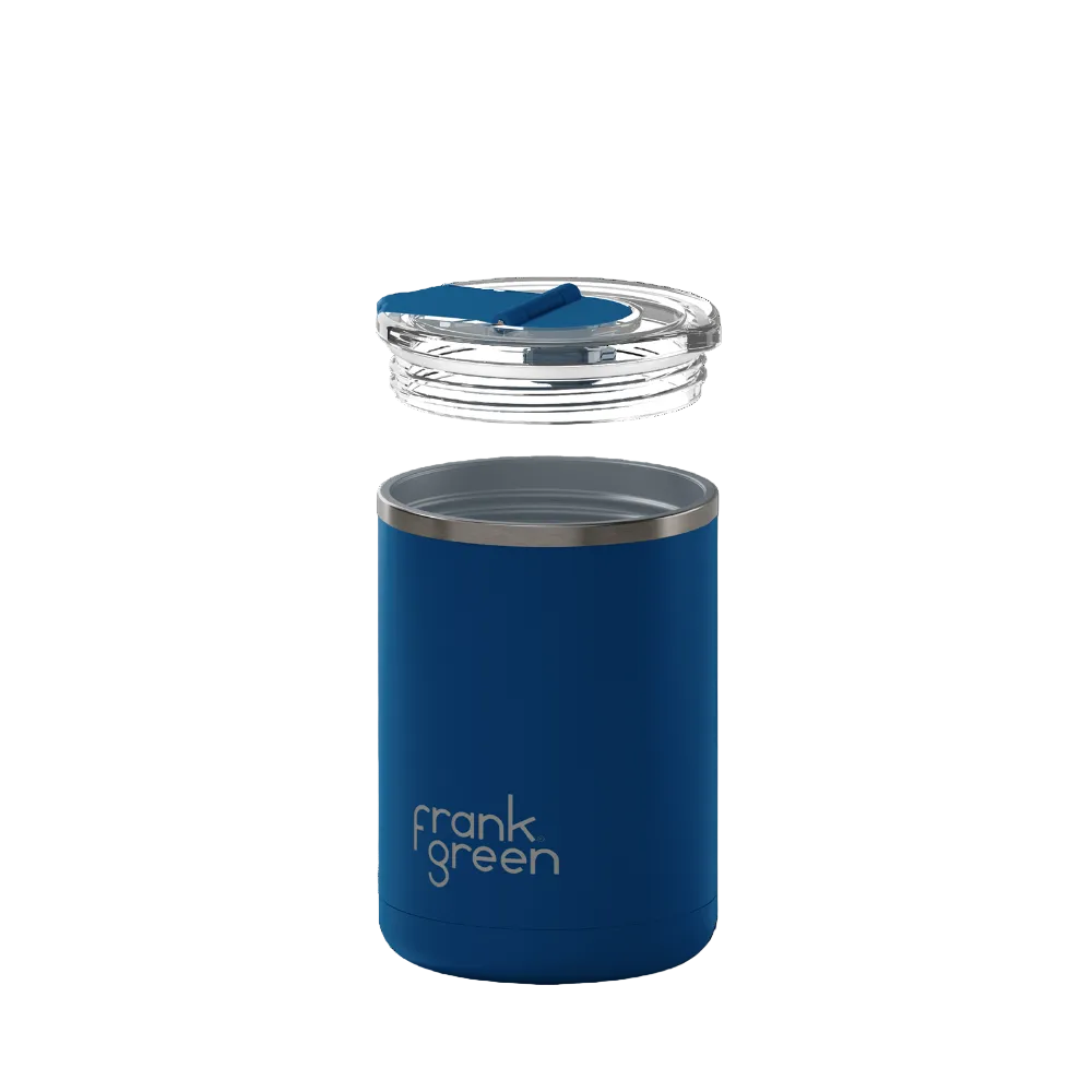 A navy blue vacuum-insulated tumbler with a clear lid and blue flip-top spout, shown floating against a solid white background. The brand name 'frank green' is printed in white on the lower front of the tumbler.
