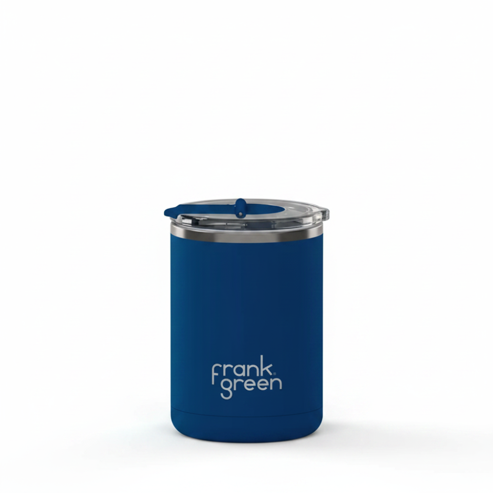 A blue Frank Green vacuum-insulated tumbler with a matching blue lid and a silver rim, shown on a plain white background.