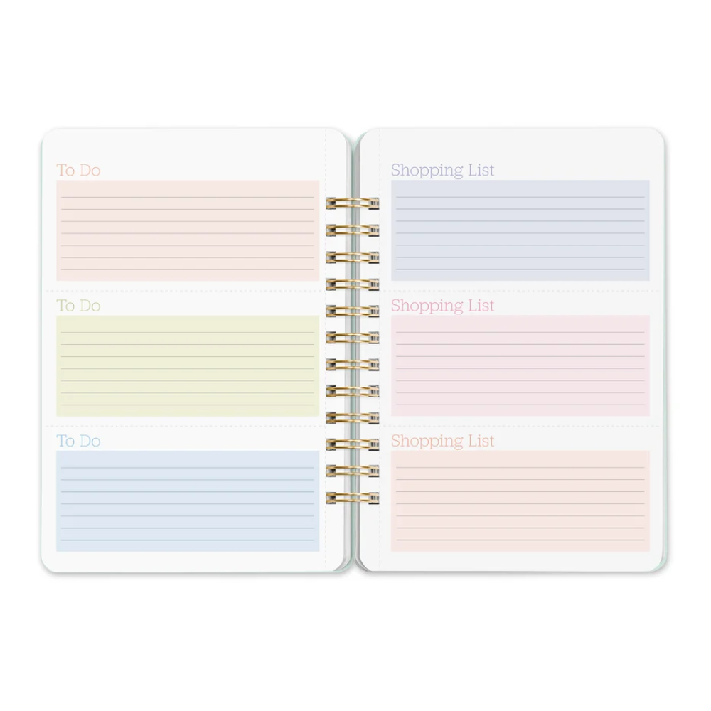 An open spiral-bound planner or notebook showing two inner pages with lined sections labeled 'To Do' and 'Shopping List' in soft pastel colors on a white background.