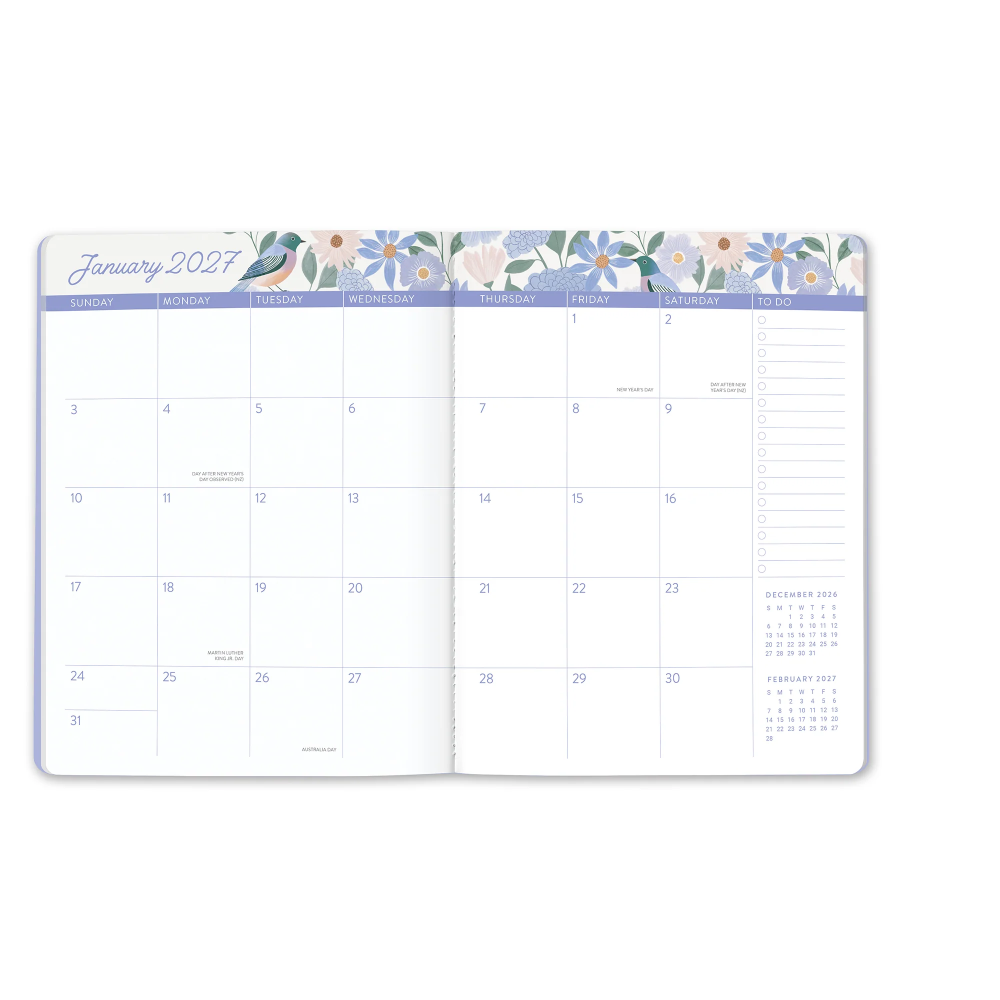 An open monthly planner showing January 2027, with a floral header across the top and columns for daily planning and a December 2026 and February 2027 calendar reference.