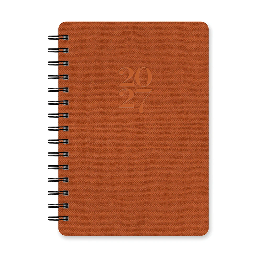 A 2027 spiral-bound planner with a textured orange-brown cover, featuring a debossed '2027' on the front and black wire binding, shown on a plain white background.