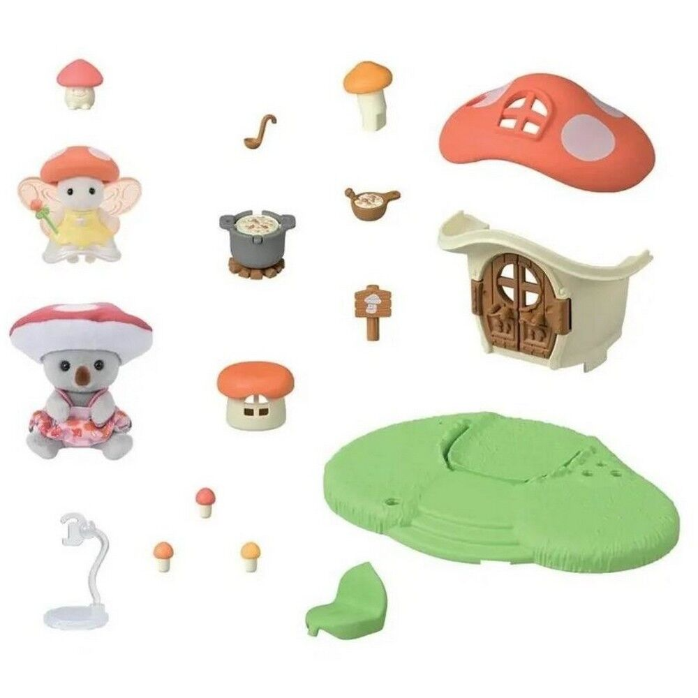 A children's mushroom-themed toy set arranged on a white background, including a small house, mushrooms, a koala figure, cooking pot, sign, lamp, and green ground piece.