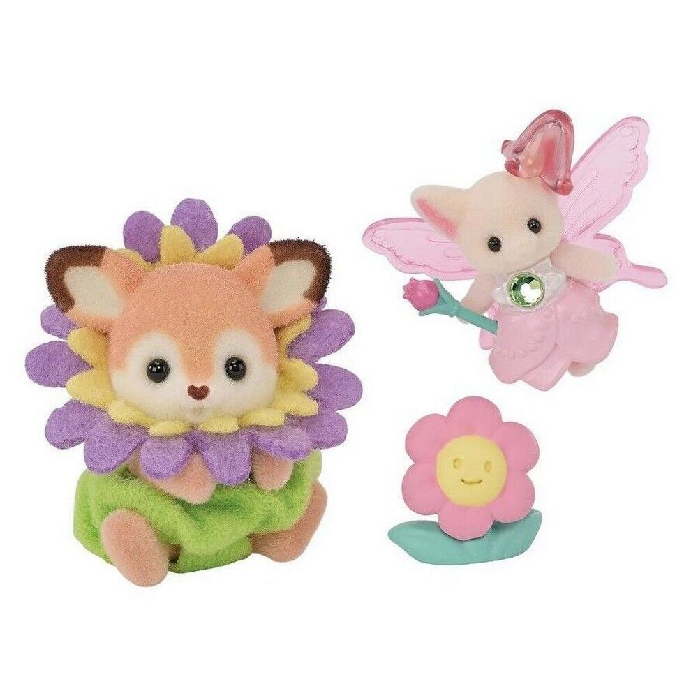 Two plush toys: a fox-like creature on a flower and a fairy with wings and a flower.
