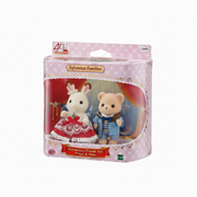 Packaged Sylvanian Families Anniversary Friends Set with Freya and Theo on a pink background