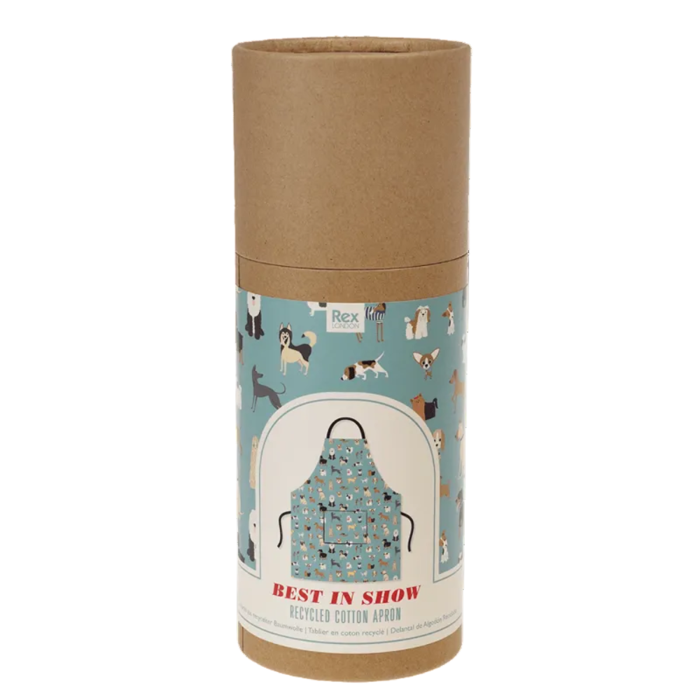 A cylindrical cardboard package for a Rexxon 'Best in Show' recycled cotton apron, featuring a light blue label with dog illustrations and an illustration of a patterned apron.