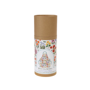 A cylindrical kraft paper package with a printed label reading 'Rex Naturals Wild Flowers Recycled Cotton Apron,' showing a colorful floral apron illustration on a white label against a plain white background.