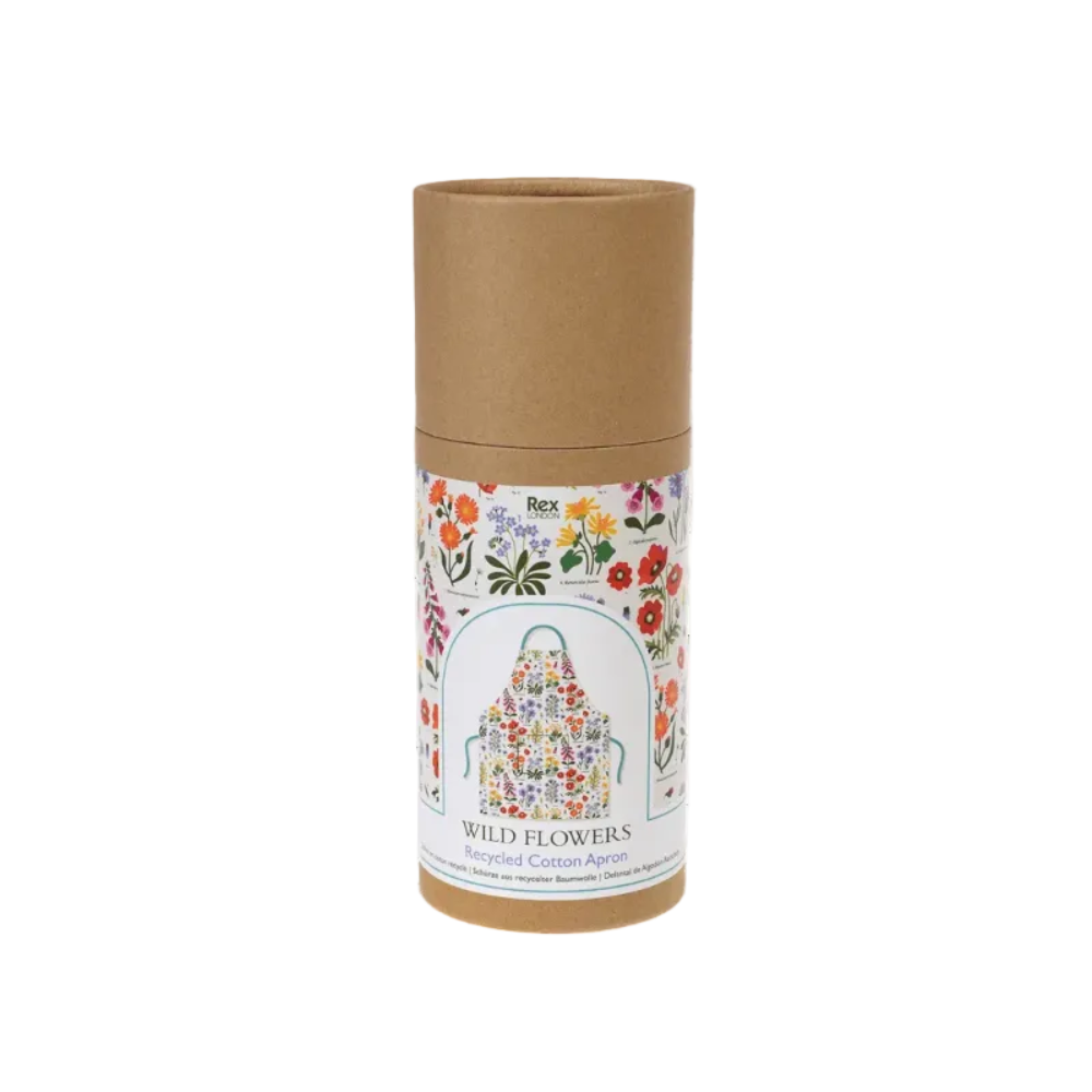 A cylindrical kraft paper package with a printed label reading 'Rex Naturals Wild Flowers Recycled Cotton Apron,' showing a colorful floral apron illustration on a white label against a plain white background.