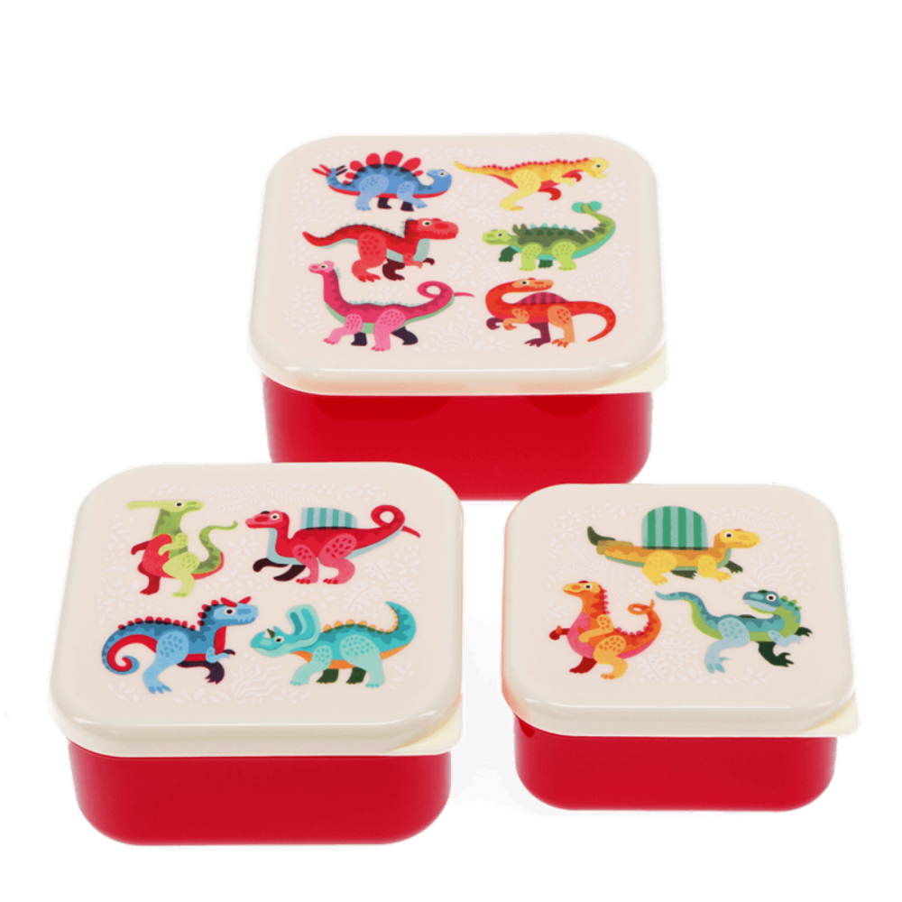 Three small square lunch boxes with red bodies and cream lids, decorated with colorful cartoon dinosaurs, shown on a white background.