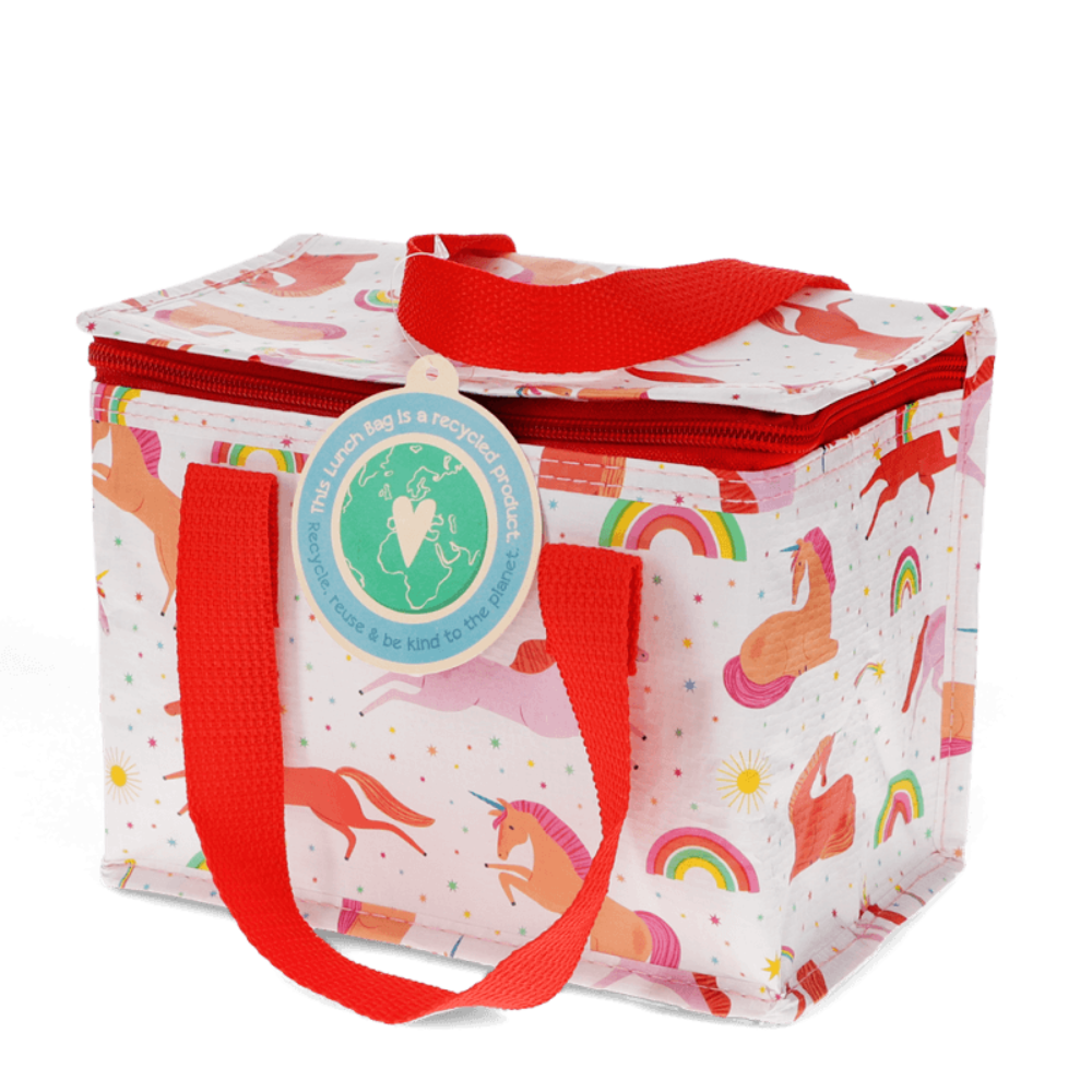 A square reusable lunch bag with a white background and colorful unicorn and rainbow print, featuring bright red handles and a red zipper, with a round green and white hangtag.