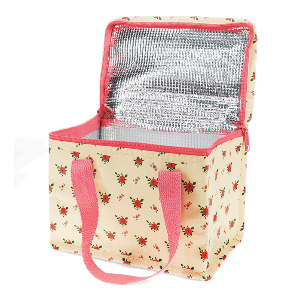 A square soft-sided cooler bag with a beige floral print, pink handles, and a silver reflective inner lining, shown open on a white background.