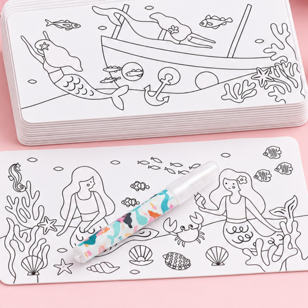 A set of white magnetic drawing boards with black line art illustrations of mermaids, fish, and sea life, shown with a small paintbrush on a clean white background.