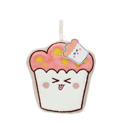 A plush cupcake-shaped cleaning sponge with pink frosting, yellow sprinkles, and a cute winking face. It features a white handle and a hanging tag with a cartoon illustration, set against a plain white background.