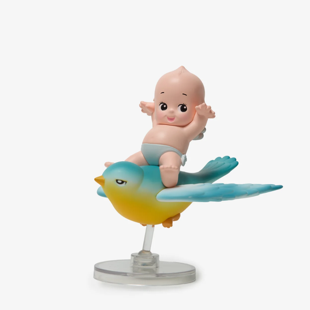 Figurine of a baby on a bird with a white background