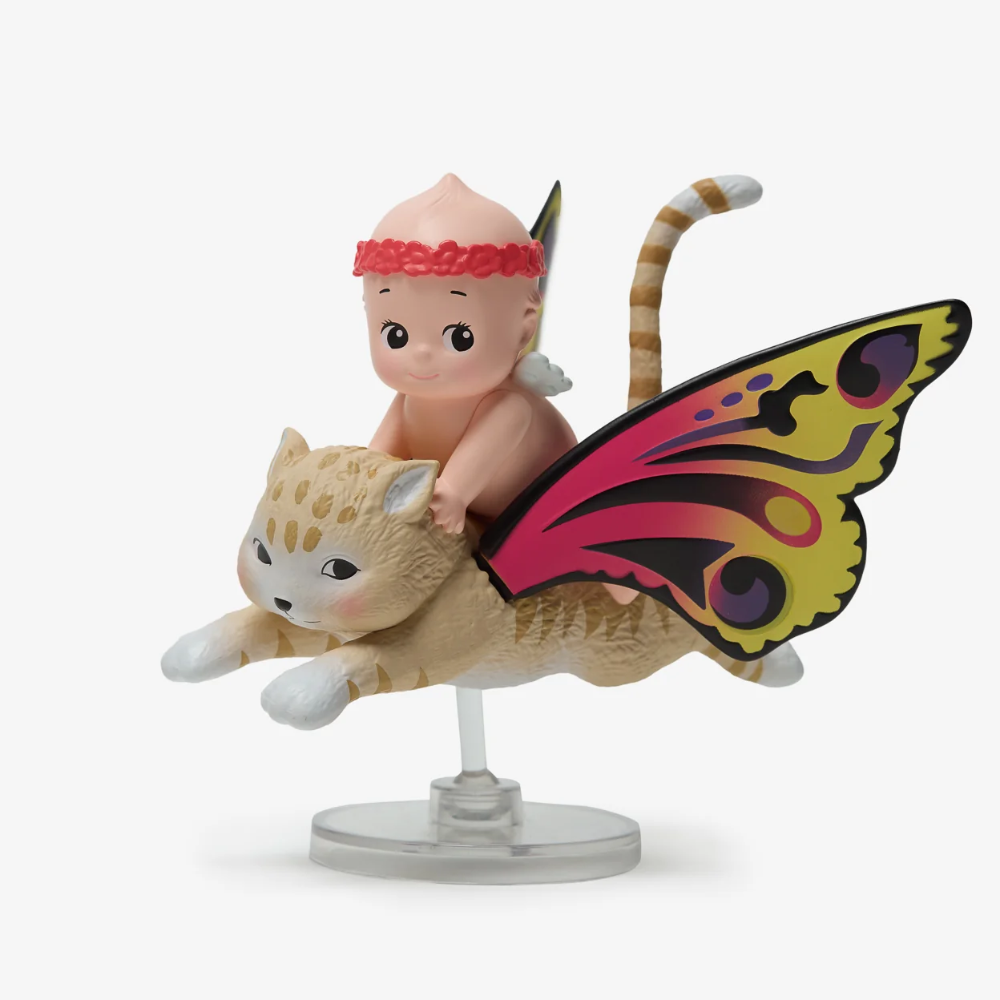 Figurine of a baby with butterfly wings and a cat-like creature on a white background