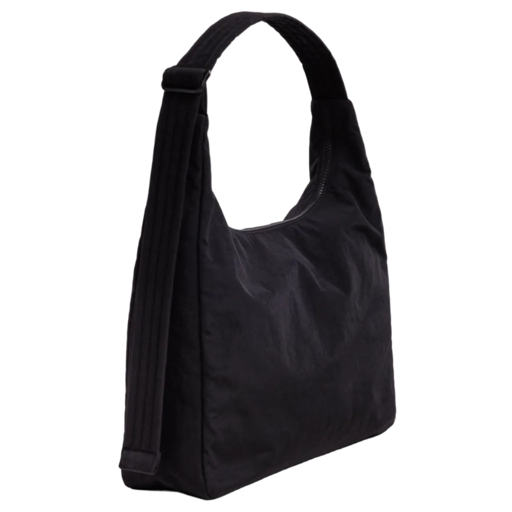 A black nylon shoulder bag with a wide, adjustable shoulder strap, shown from a three-quarters angle against a light gray studio background.