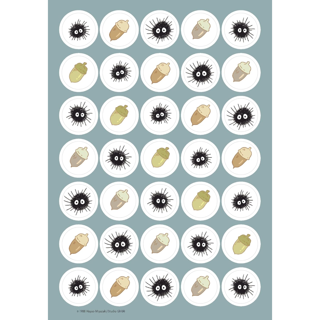 A sheet of round sticker decals featuring a repeating pattern of cute cartoon sea urchins and acorns in black, beige, and olive green on a muted blue-gray background.
