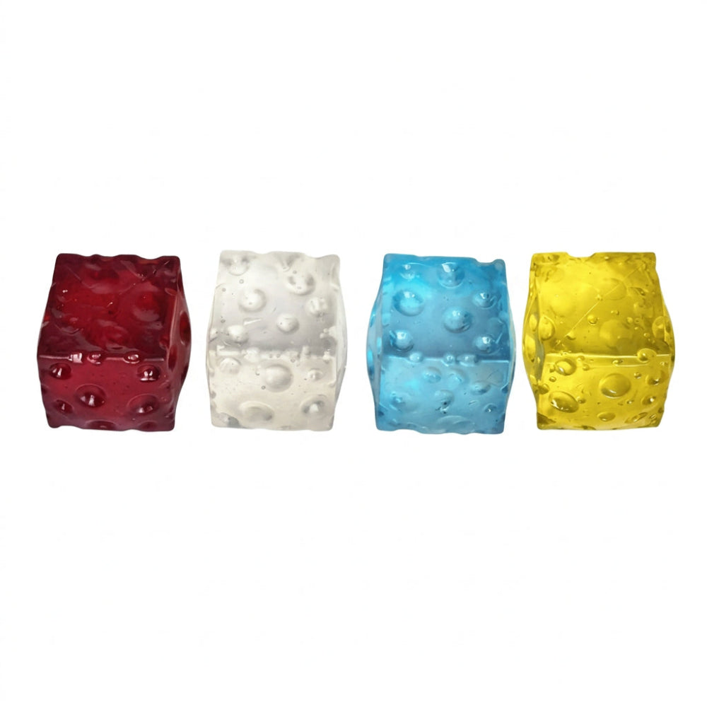 Four small cube-shaped decorative items with a textured, bubbly surface, shown in red, white, blue, and yellow on a plain white background.