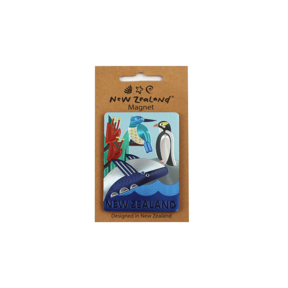 A New Zealand-themed refrigerator magnet on a brown kraft card hanger. The magnet features colorful illustrations of a blue-tongued bird, a penguin, a dolphin, and red flowers on a light blue background, with 'NEW ZEALAND' written at the bottom.