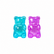 A retail display box of Squish! Gummy Bear Squishy surprise gummy bears, with three large translucent gummy bears in pink, blue, and purple displayed in front of the black and colorful packaging.