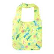 A reusable folding tote bag in bright yellow with a colorful bird and floral print, shown alongside its folded matching pouch on a white background.