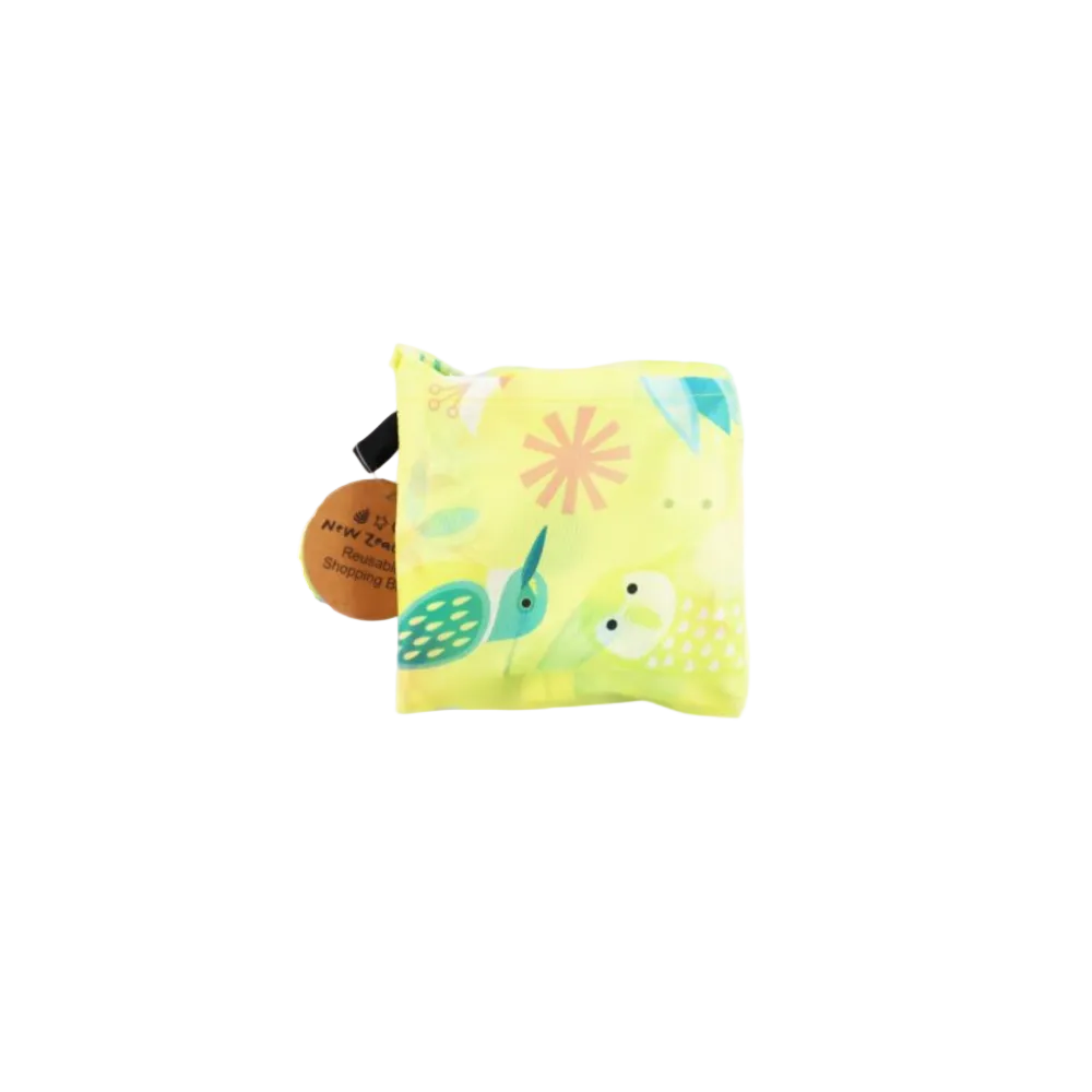 A reusable folding tote bag in bright yellow with a colorful bird and floral print, shown alongside its folded matching pouch on a white background.
