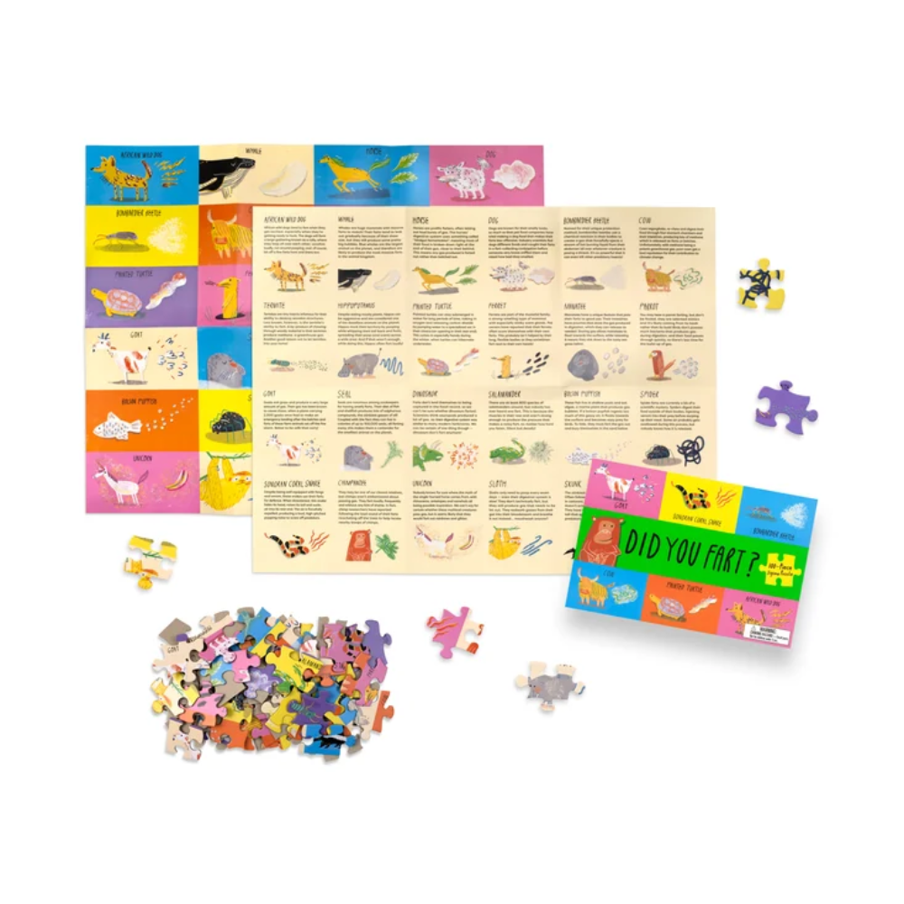 A children's educational jigsaw puzzle set displayed on a white background, including a colorful storage box, a partially assembled puzzle board, loose puzzle pieces, and a pile of small multicolored pieces. The box reads 'WILD YOU MAT!'.
