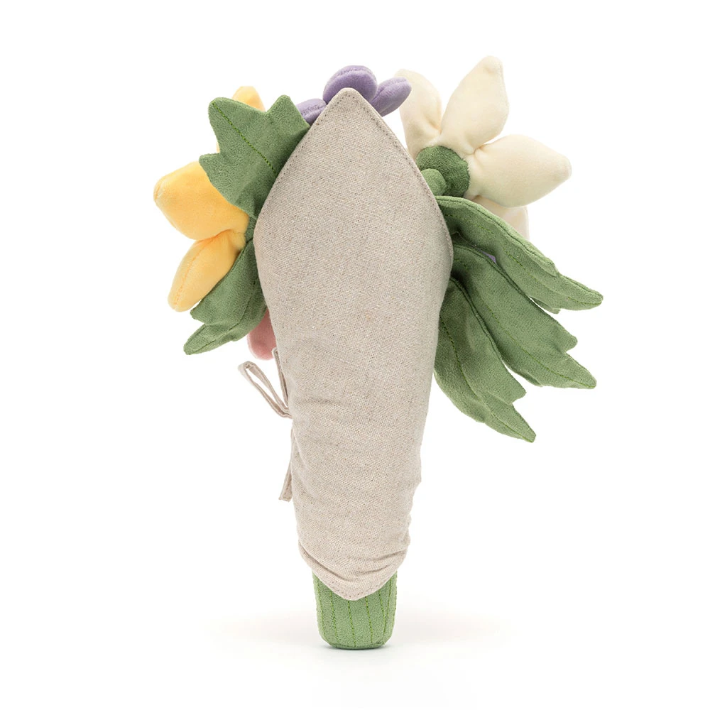 Plush toy shaped like a flower with green leaves and a beige center on a white background