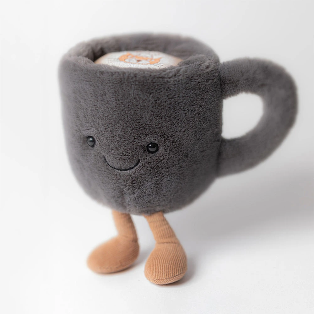 Plush toy shaped like a cup with legs on a white background