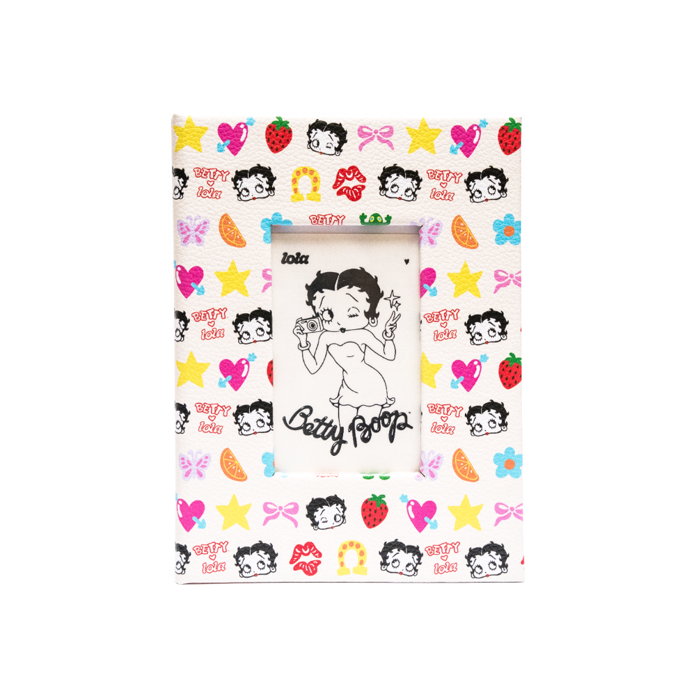 A square picture frame featuring a colorful Betty Boop pattern with strawberries, bows, stars, and hearts on a white background, with a central black-and-white Betty Boop illustration.