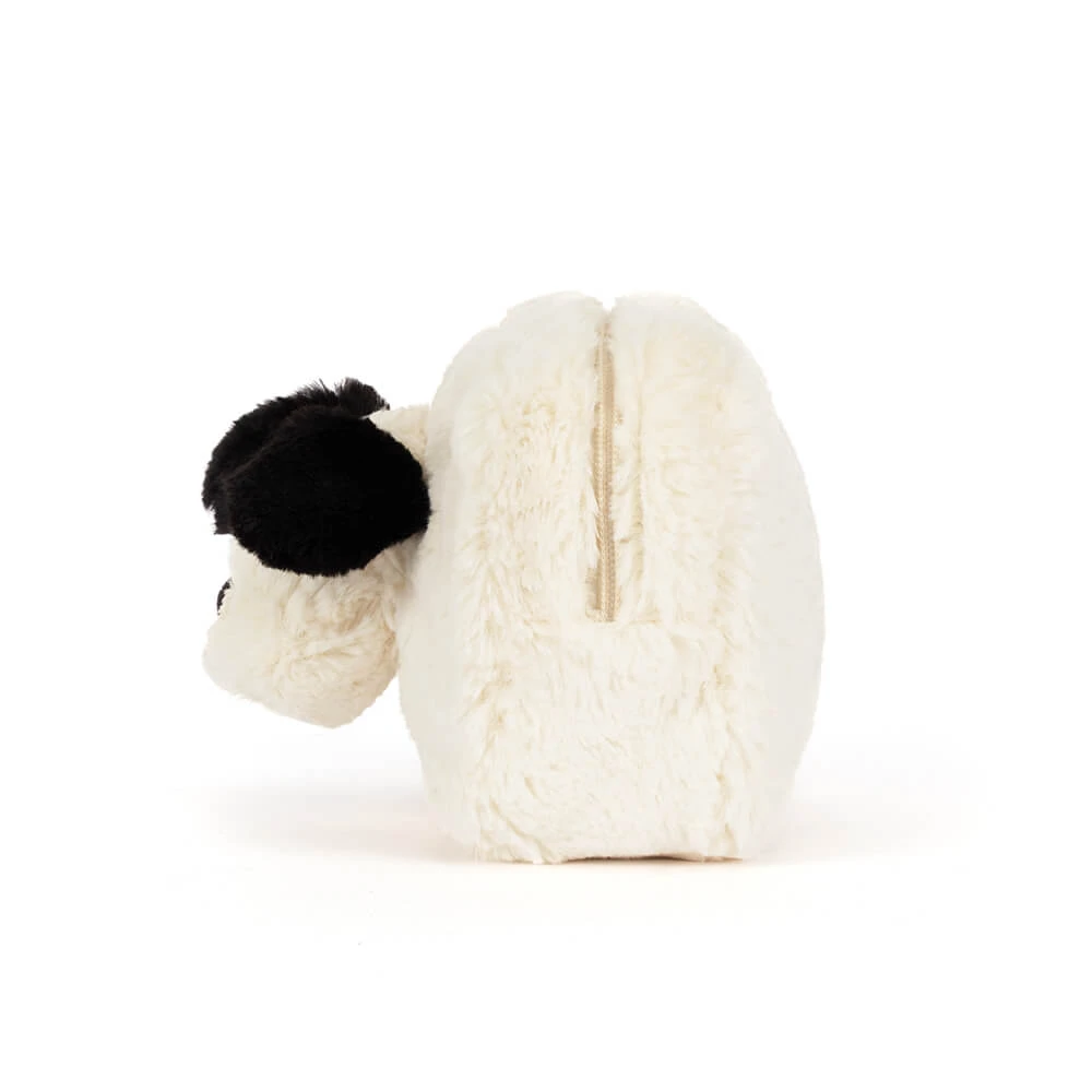 A plush sheep-shaped zippered pouch in cream white faux fur with a black fluffy ear, shown from the side on a white background.