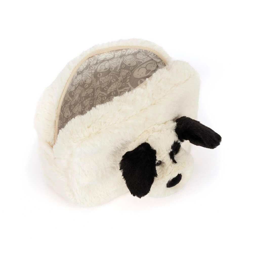 A plush dog-shaped pouch or small bag made of soft faux fur, shown on a plain white background. The exterior is cream white with black ears, nose, and eye details, and the inside lining has a gray patterned print.