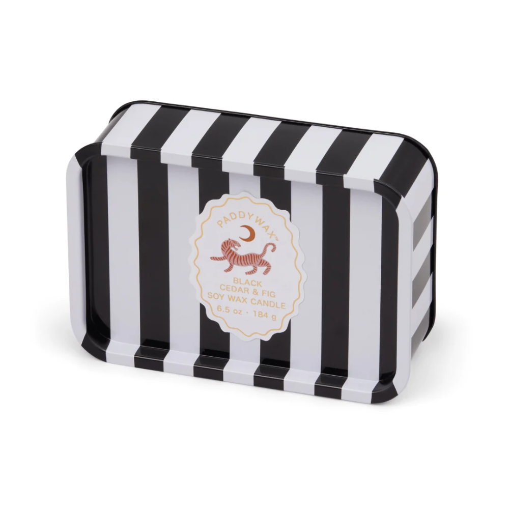 Black and white striped candle tin with a brand logo on a white background