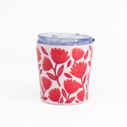 A pink insulated tumbler with a red floral pattern and a clear plastic lid, shown on a plain white background.