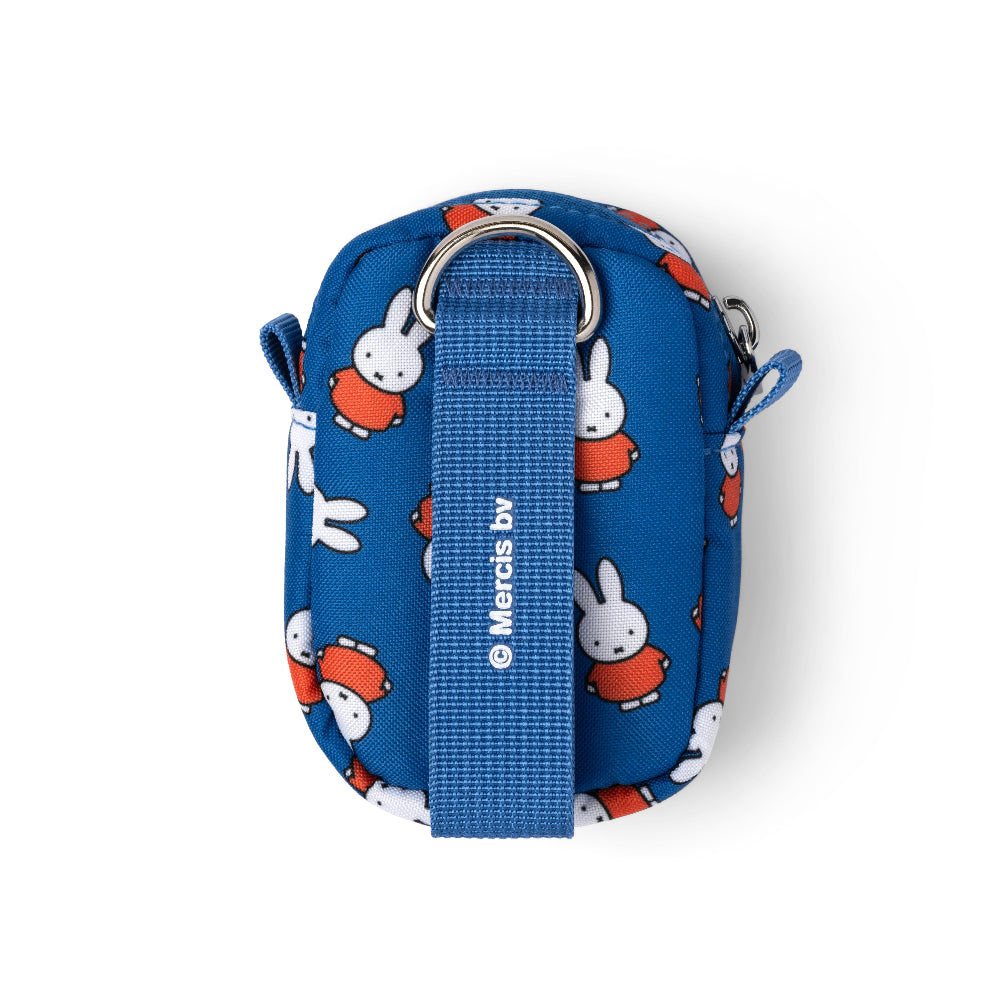 A blue fabric pouch featuring a repeating pattern of Miffy the rabbit in her red dress, with a matching blue webbed strap and silver metal ring, shown on a white background.
