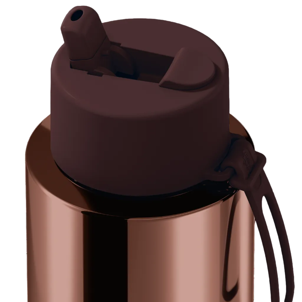 Close-up of a stainless steel water bottle with a metallic rose gold body and a dark brown silicone flip-straw lid with a carrying loop, shown on a white background.