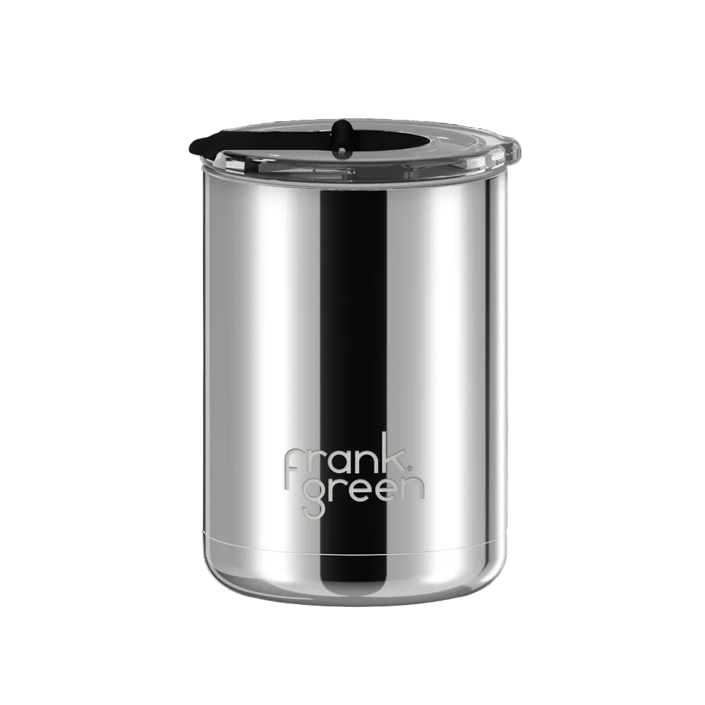 A stainless steel travel tumbler with a black lid and a black vertical stripe, featuring the 'frank green' logo near the bottom, set against a plain white background.