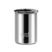 A stainless steel travel tumbler with a black lid and a black vertical stripe, featuring the 'frank green' logo near the bottom, set against a plain white background.