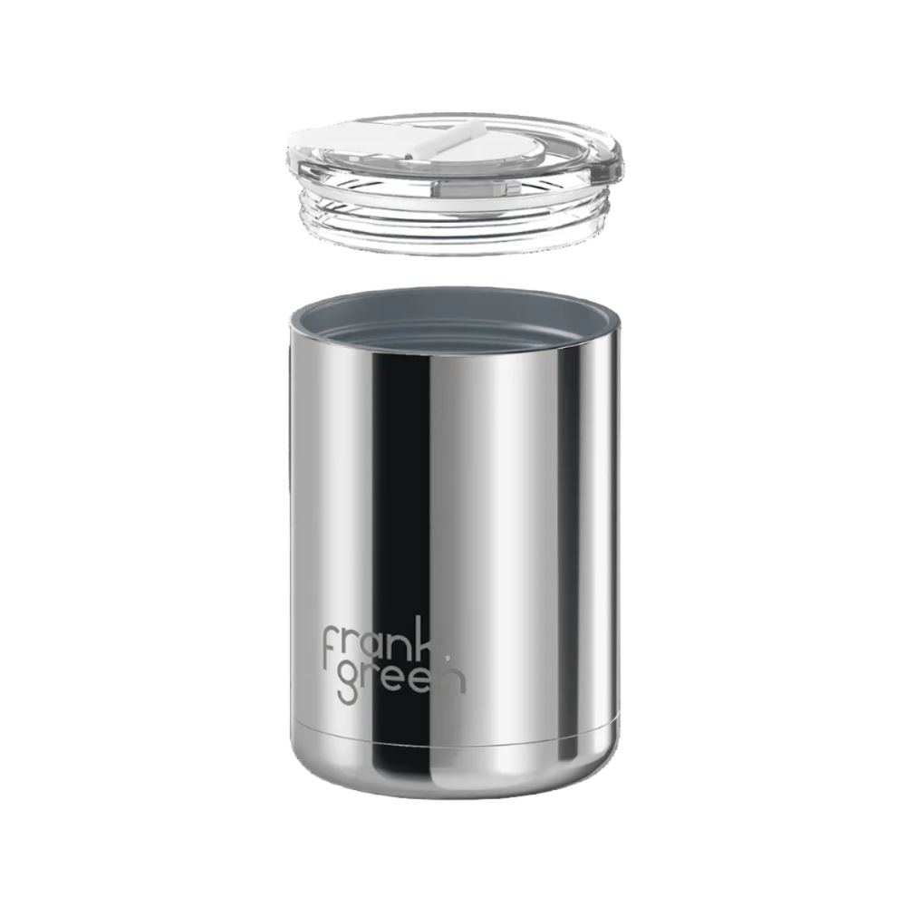 A stainless steel travel tumbler with a clear lid, shown with the lid removed and floating above the container. The brand name 'frank green' is printed on the front.